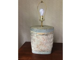A Basket Based Table Lamp In A White Wash Finish