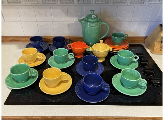 FIESTA COFFEE POT AND 11 CUPS AND SAUCERS