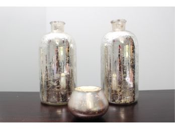 A Pair Of Mercury Glass Vases And One Candle