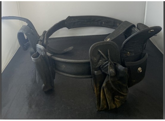 Black Sturdy Worker's Utility Belt With Plenty Of Metal Snaps & Pockets. Adjustable From The 30s To 42 Inches