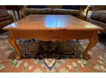 Blonde Knotty Hardwood Low Coffee Table With Shell Finial Detail And Short Cabriole Legs