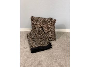 Two Leopard Pillows And A Polyester Throw