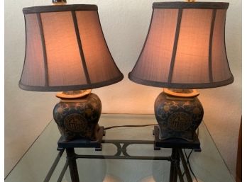 Pair Of Black And Gold Colored Lamps With Oval Shades