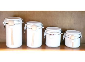 Set Of Four White Ceramic Canisters By The Market Place