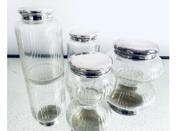 Four Glass Vanity Jars