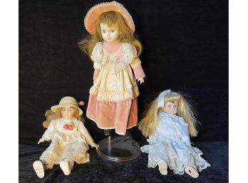 Set Of Three Porcelain Dolls
