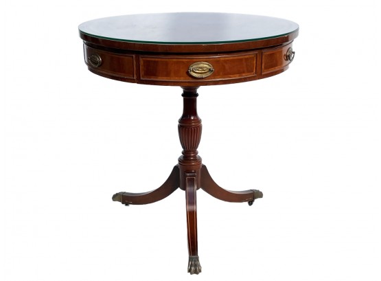 A Banded Mahogany Embossed Leather Library Table With Glass Top