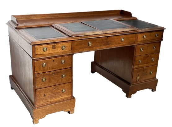 A 19th Century Paneled English Oak And Leather Writing Desk