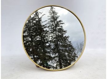 A Modern Brass And Glass Mirror