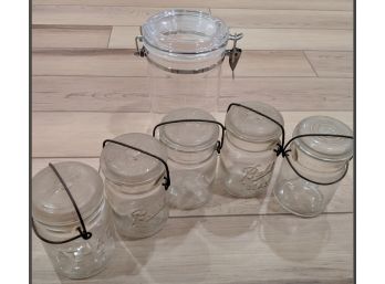 Five Ball Jars With One Plastic Container