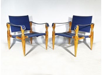 A Pair Of Vintage Maple Frame Safari Chairs With Canvas Suspension Upholstery
