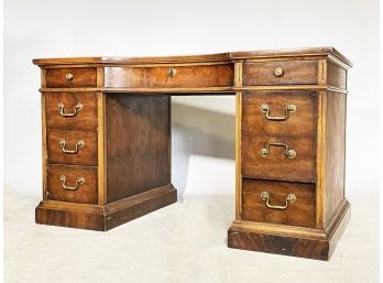 A Vintage Leather Top Walnut Kneehole Desk With Brass Fittings