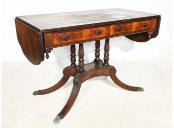 An Early Nineteenth Century Mahogany Drop Leaf Library Table