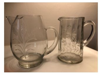 Two Etched Glass Pitchers