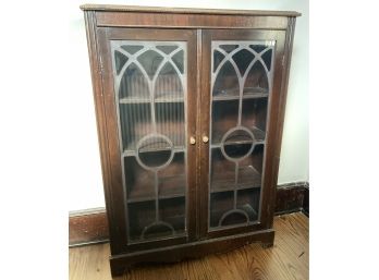 Antique Book Case With Glass Doors And Metal Window Decor