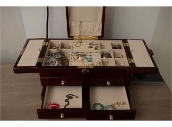 A Wooden Jewelry Box Full Of Jewelry