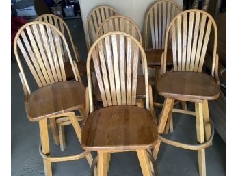Seven Vintage Oak Swivel Barstools In Good Condition