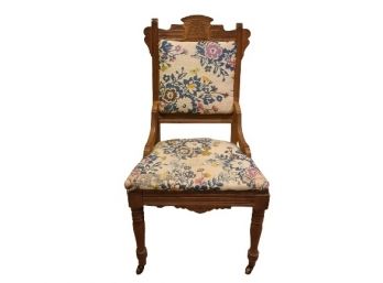 Re-Upholstered Hand Carved Chair On Casters
