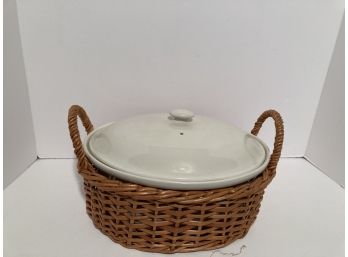 White Covered Pot In Wicker Carrier