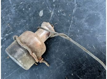 Old Bottle On Twisted Wire Hook