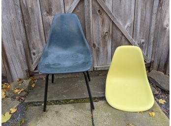 Two Shell Chairs Green One Eames And The Blue One Has Base