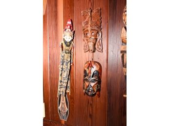 Assortment Of Carved African And Asian Wooden Masks And Figures