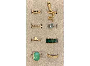 Collection Of Eight Gold Tone And Green Stone Rings