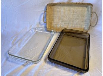 2 Oven Proof Glass Baking Dishes Plus Wicker Carrier, (1 Pyrex 10x8in, 1 Anchor Hocking 13.5x8.75x1.75)used.