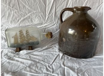 An Old Gallon Stone Jug And A Swedish Naval Ship In A Bottle.