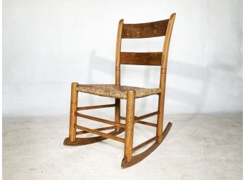 A Vintage Rush Seated Ladder Back Rocking Chair