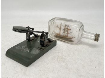 A Ship In A Bottle And Vintage Hole Punch