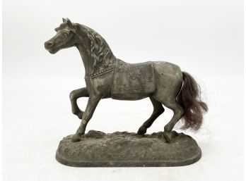 An Antique Cast Metal Horse