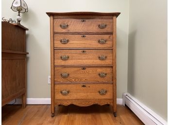 A Late 19th Century Paneled Oak Chest Of Drawers With Original Bronze Hardware