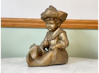 An Antique Cast Plaster Dutch Boy Statue