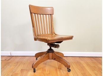 An Antique Oak Desk Chair