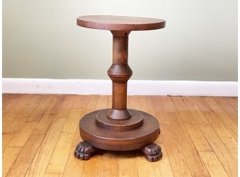 A Carved Oak Footed Plant Stand