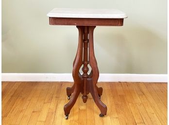 An Edwardian Carved Mahogany Marble Top Side Table