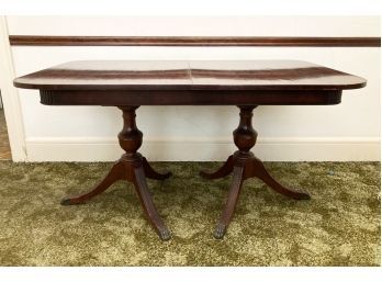 A Vintage Mahogany Extendable Spindle Base Dining Table