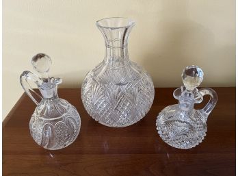 Two Cut Crystal Cruets And A Carafe