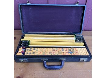 A Vintage Mahjong Set In A Leather Case