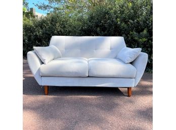 A Light Gray Upholstered Love Seat