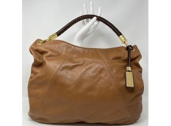 A Michael Kors Leather Slouch Handbag With Braided Leather Handle