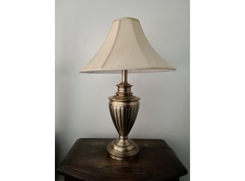 A Brass Table Lamp And Shade