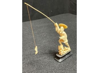 Small Asian Fisherman Figurine