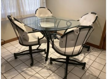 Glass Top Table And 4 White Cushioned Arm Chairs