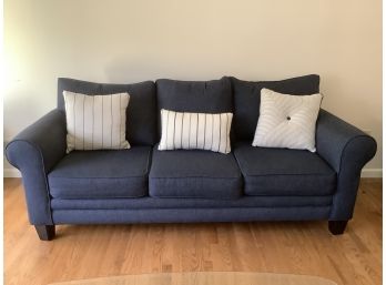 Comfy Blue Couch With Blue And White Throw Pillows