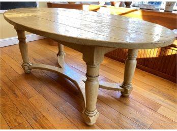 A Distressed Plank Style Oval Table By  The Farmhouse Collection Inc.  Idaho, USA
