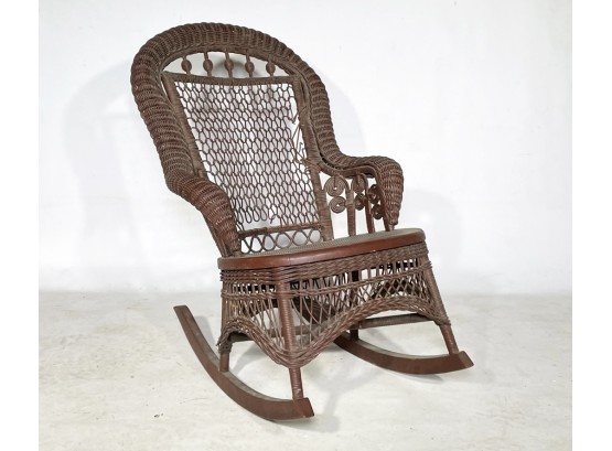 An Antique Painted Wicker Rocking Chair