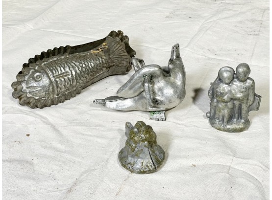 An Assortment Of Antique Tin And Pewter Chocolate Molds