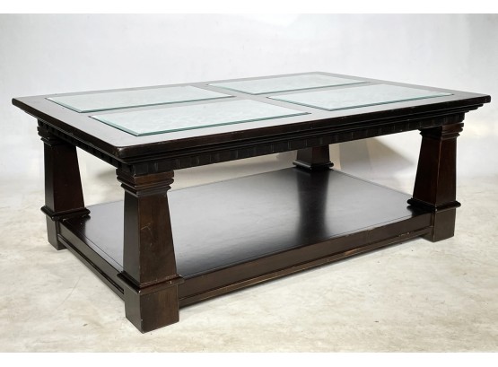 A Spanish Style Coffee Table With Glass Top